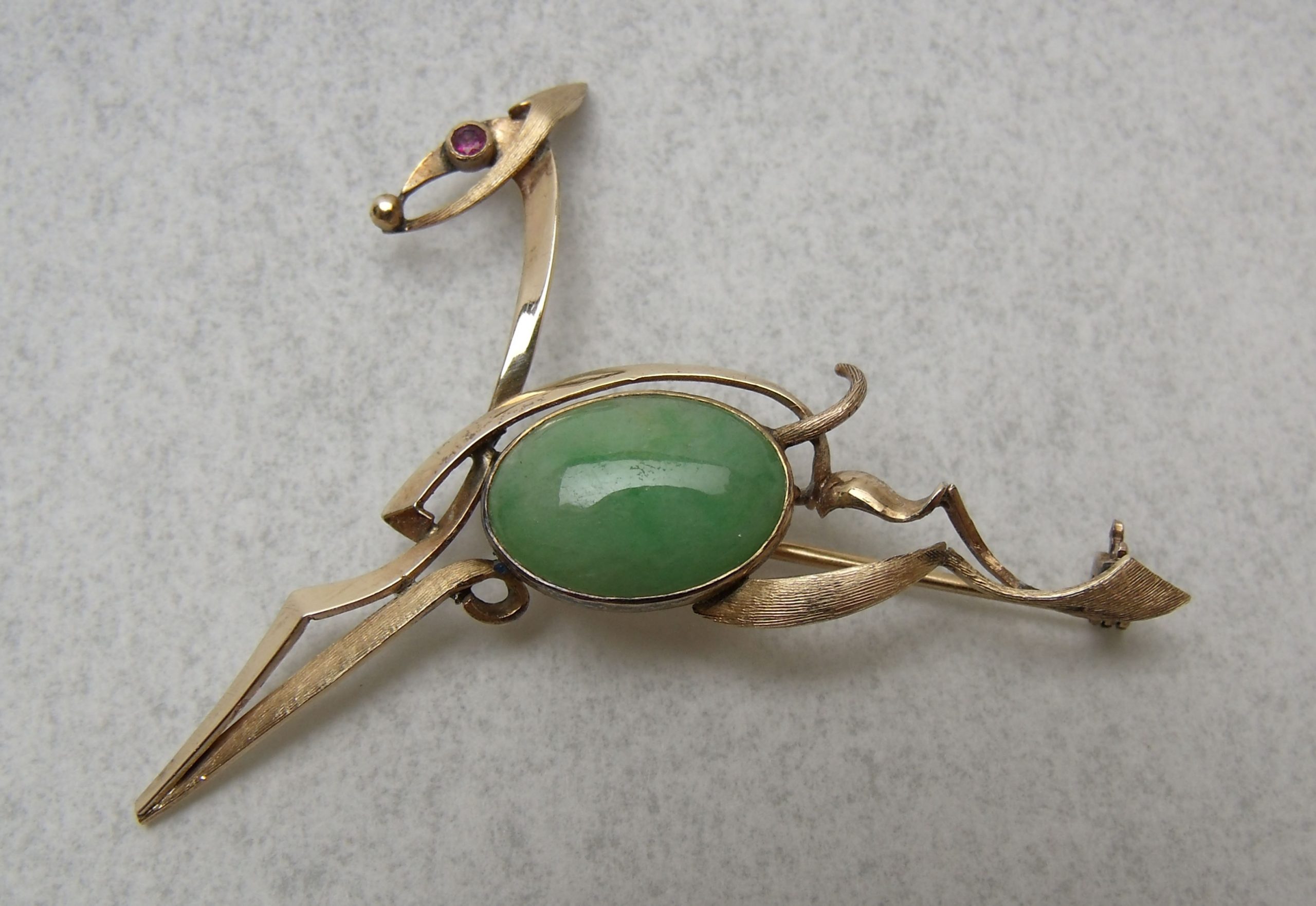 A 14ct gold hand made brooch in the form of a horse