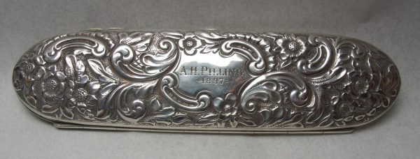 Decoration on top of Victorian sterling silver spectacles case