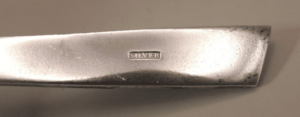 A Sterling Silver spoon with abalone shell decoration